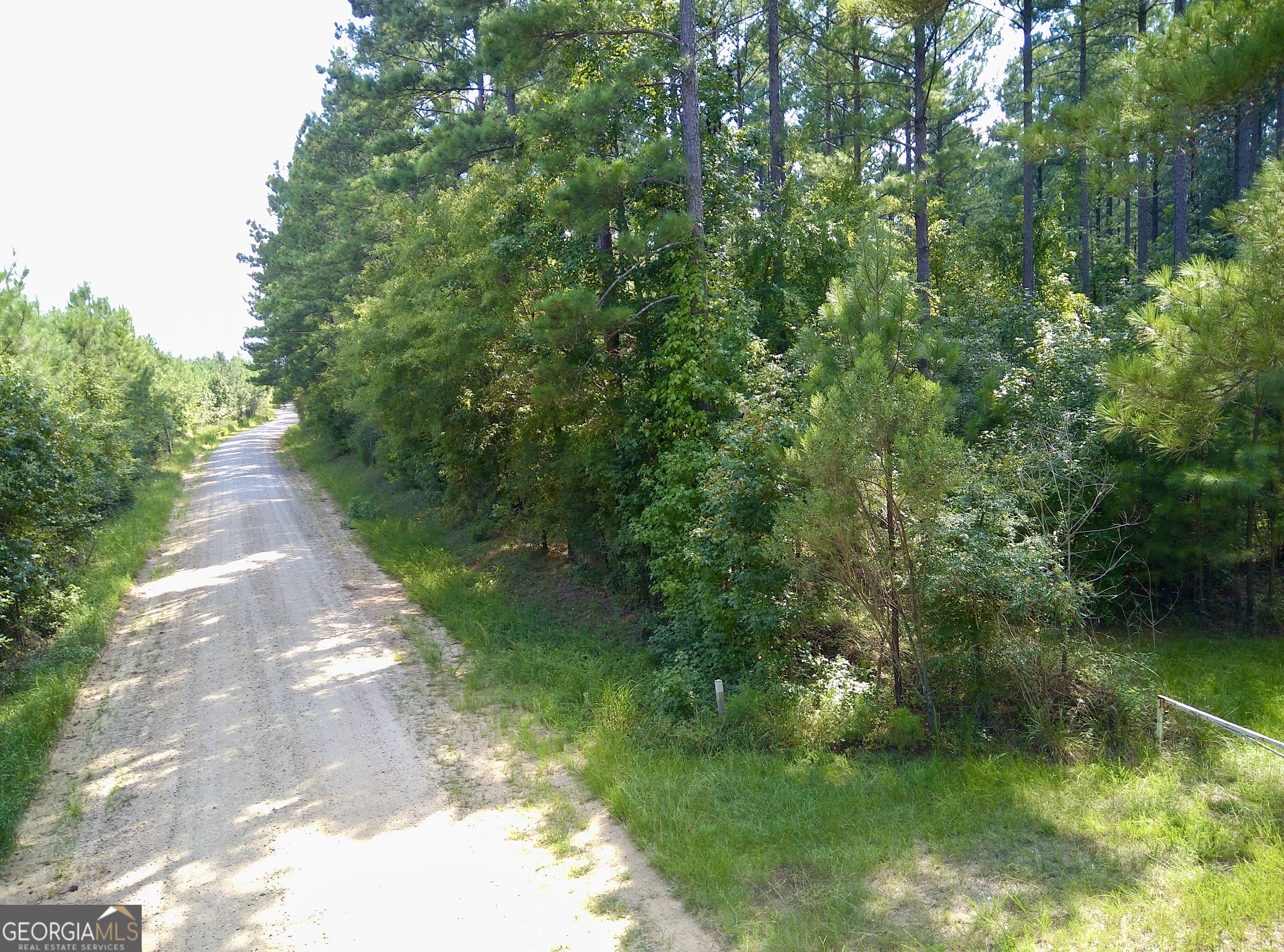 a view of a lake with a yard