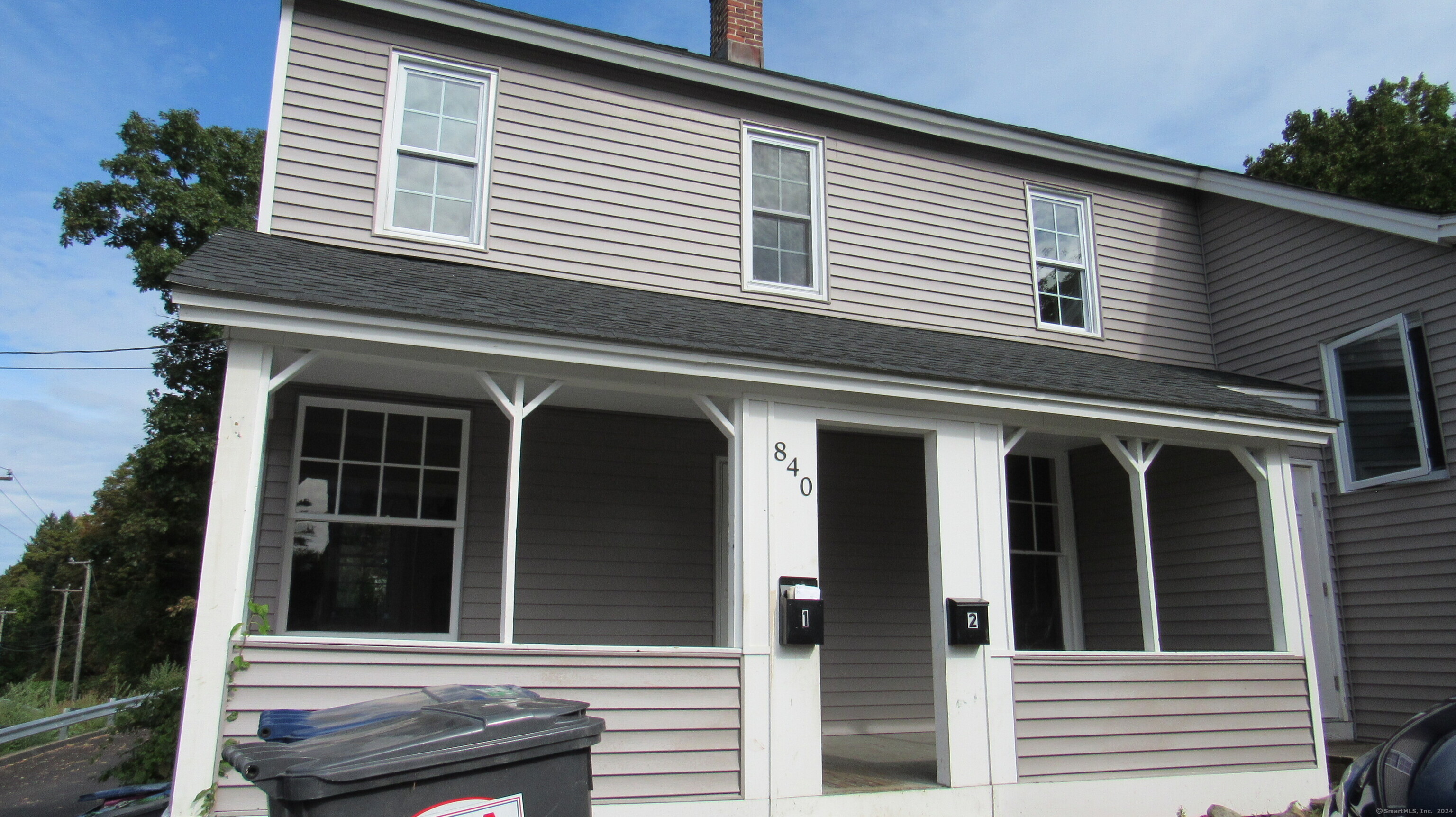 a view of a house with a window and wooden floor