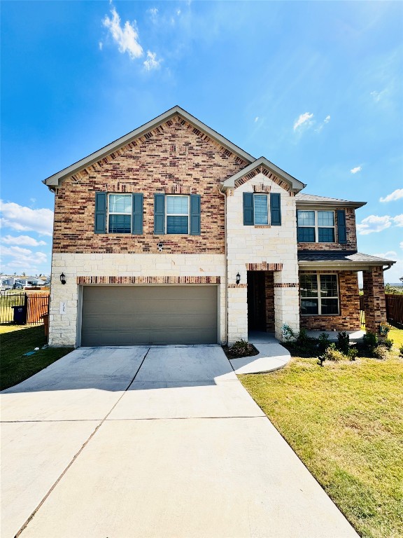 a front view of a house with yard and sitting area