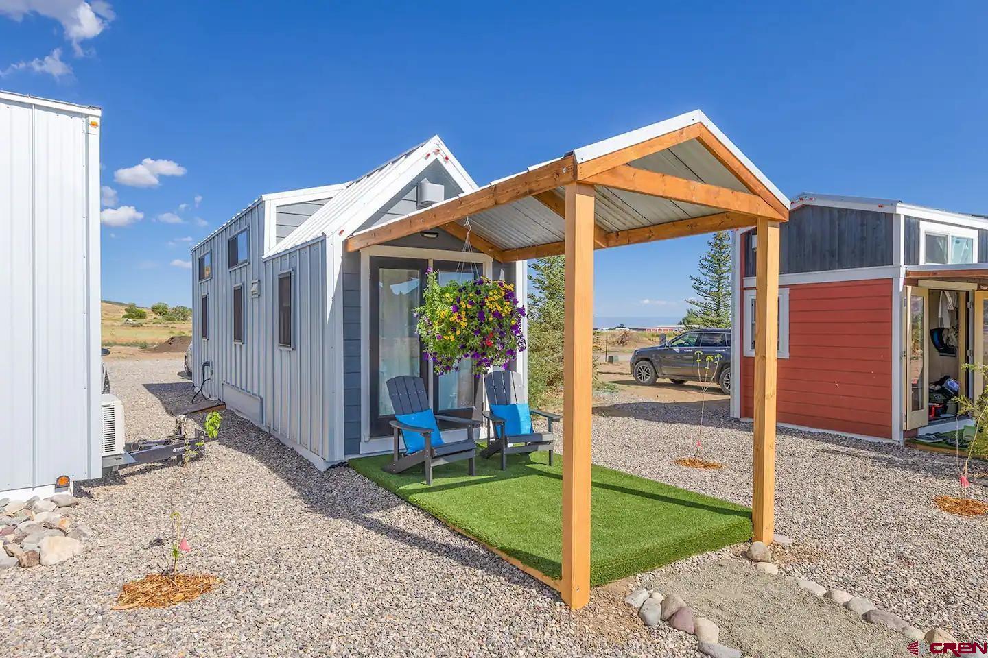 a view of a house with a backyard