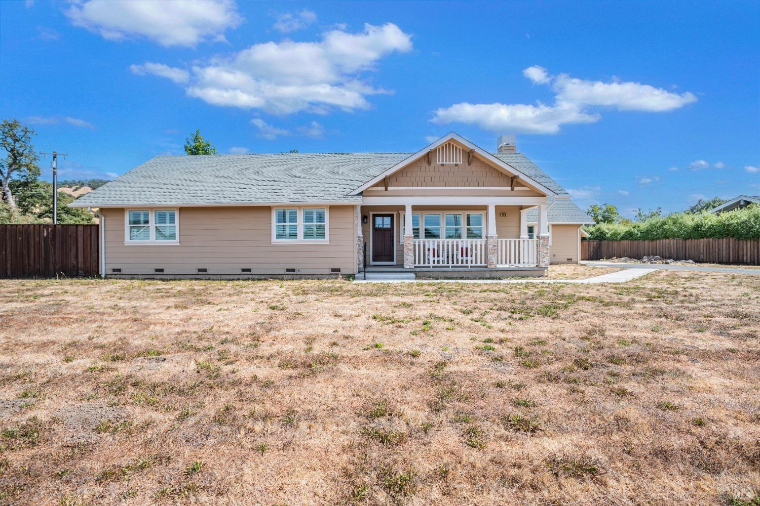 a front view of a house with a yard