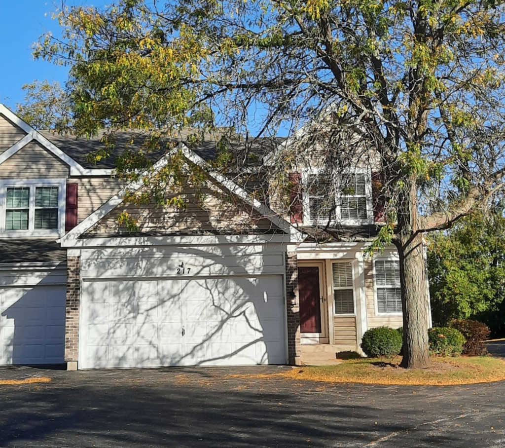 a view of a house with a tree