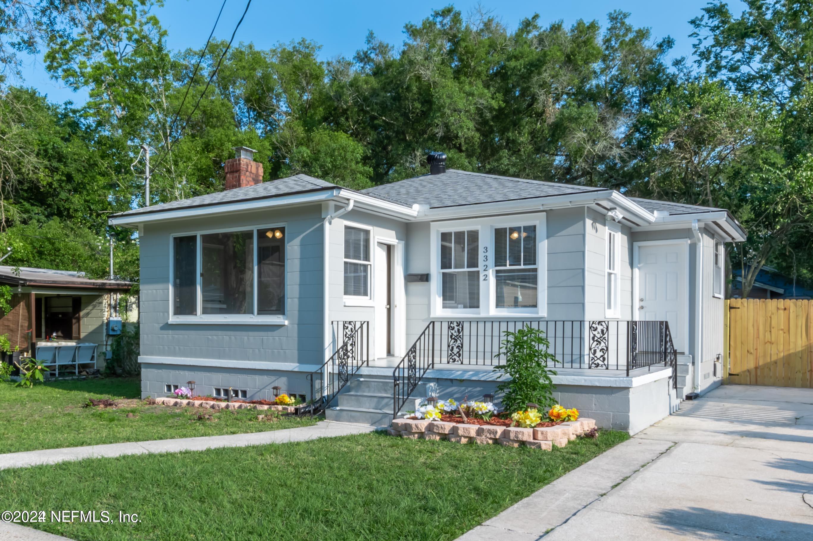 front view of a house with a yard