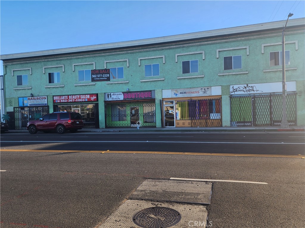 a view of a building with car parked