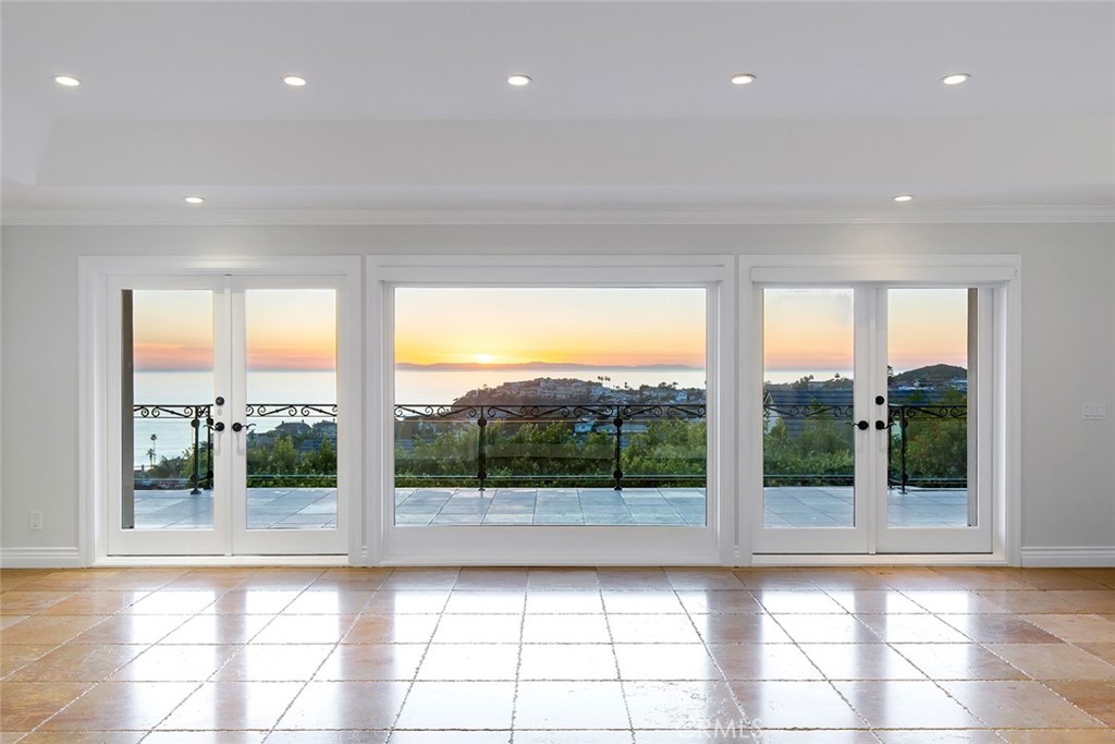 a view of an empty room and a window