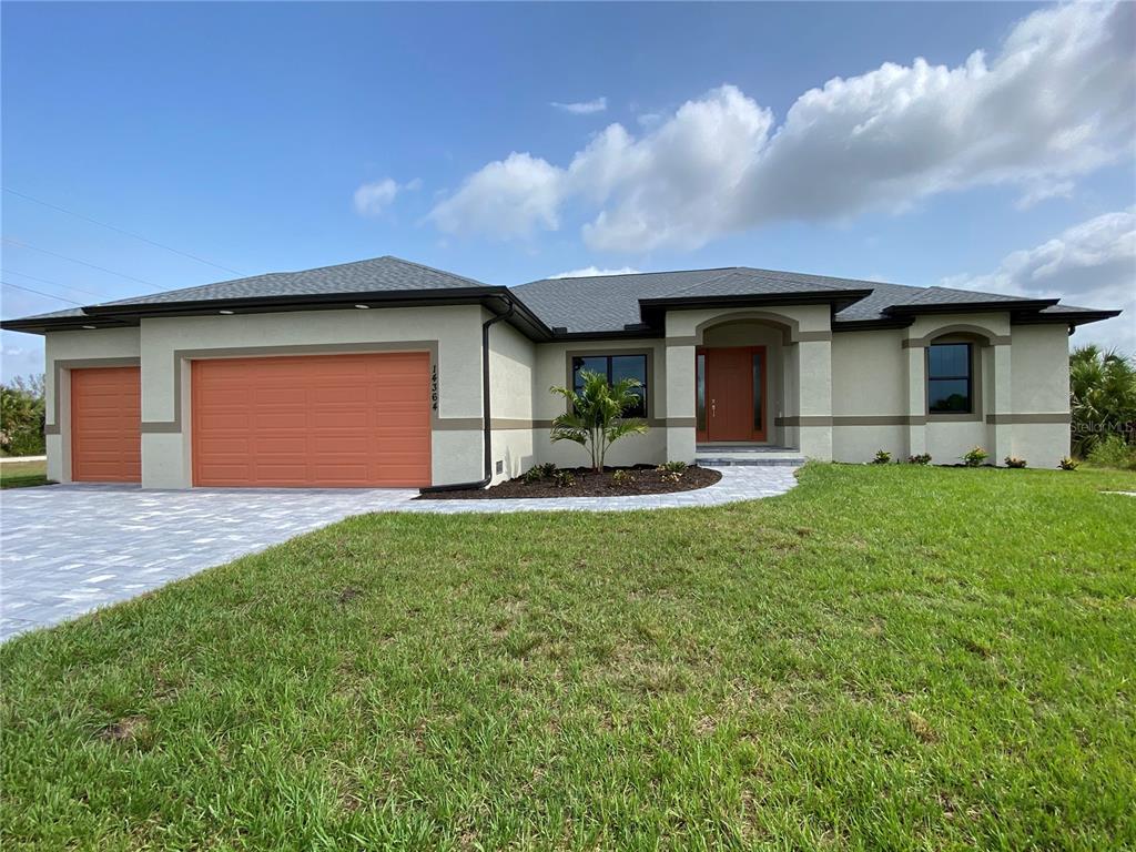 a front view of house with yard and outdoor seating