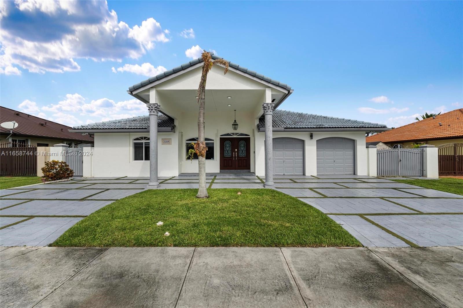 a front view of a house with a yard