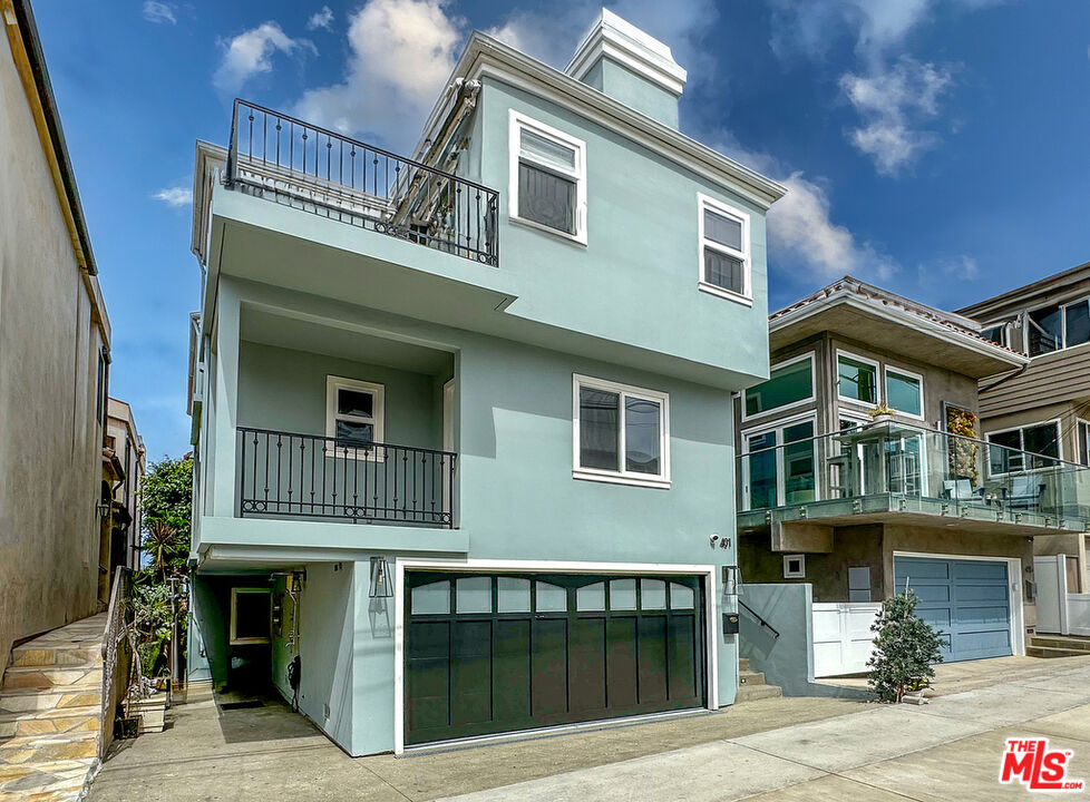 a front view of residential houses with stairs