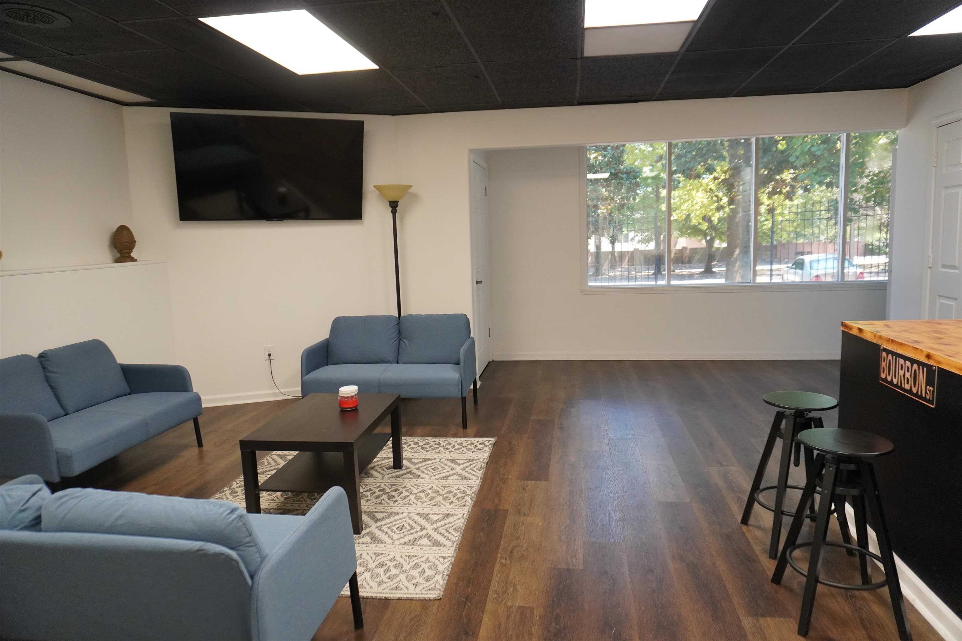 a living room with furniture and a flat screen tv