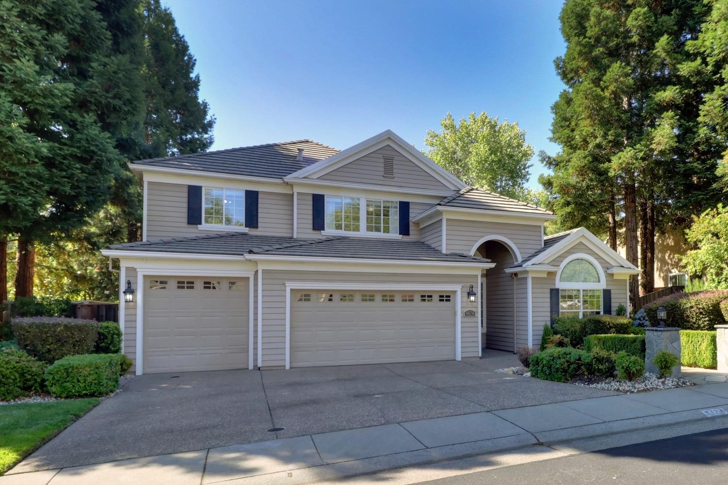 a front view of a house with a garage