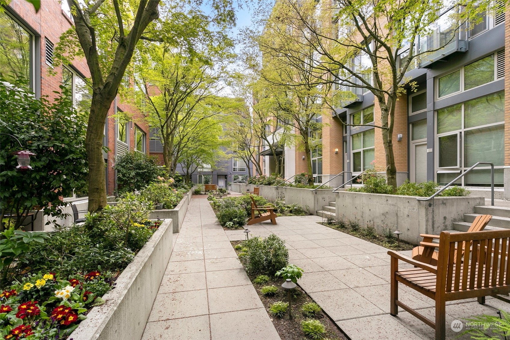 a view of a pathway with a garden