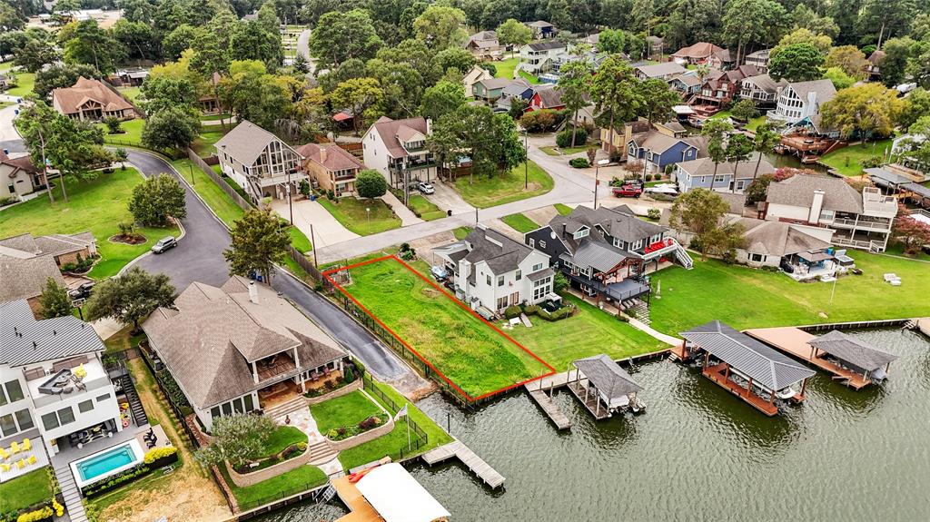 an aerial view of a house with a swimming pool yard and outdoor seating