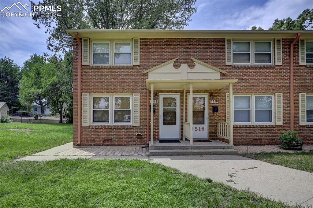 front view of a house with a yard