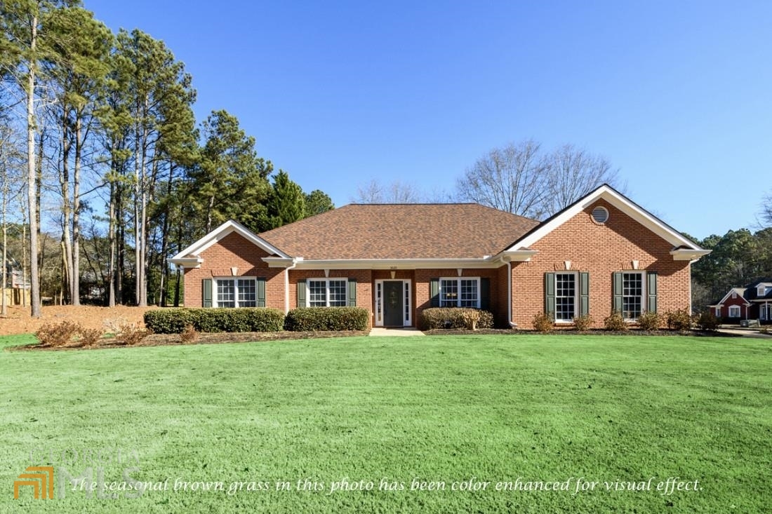 a front view of a house with a yard