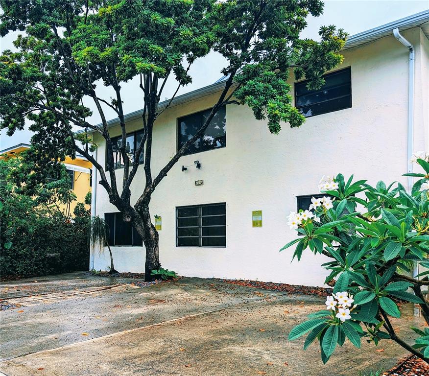 a view of a house with a tree