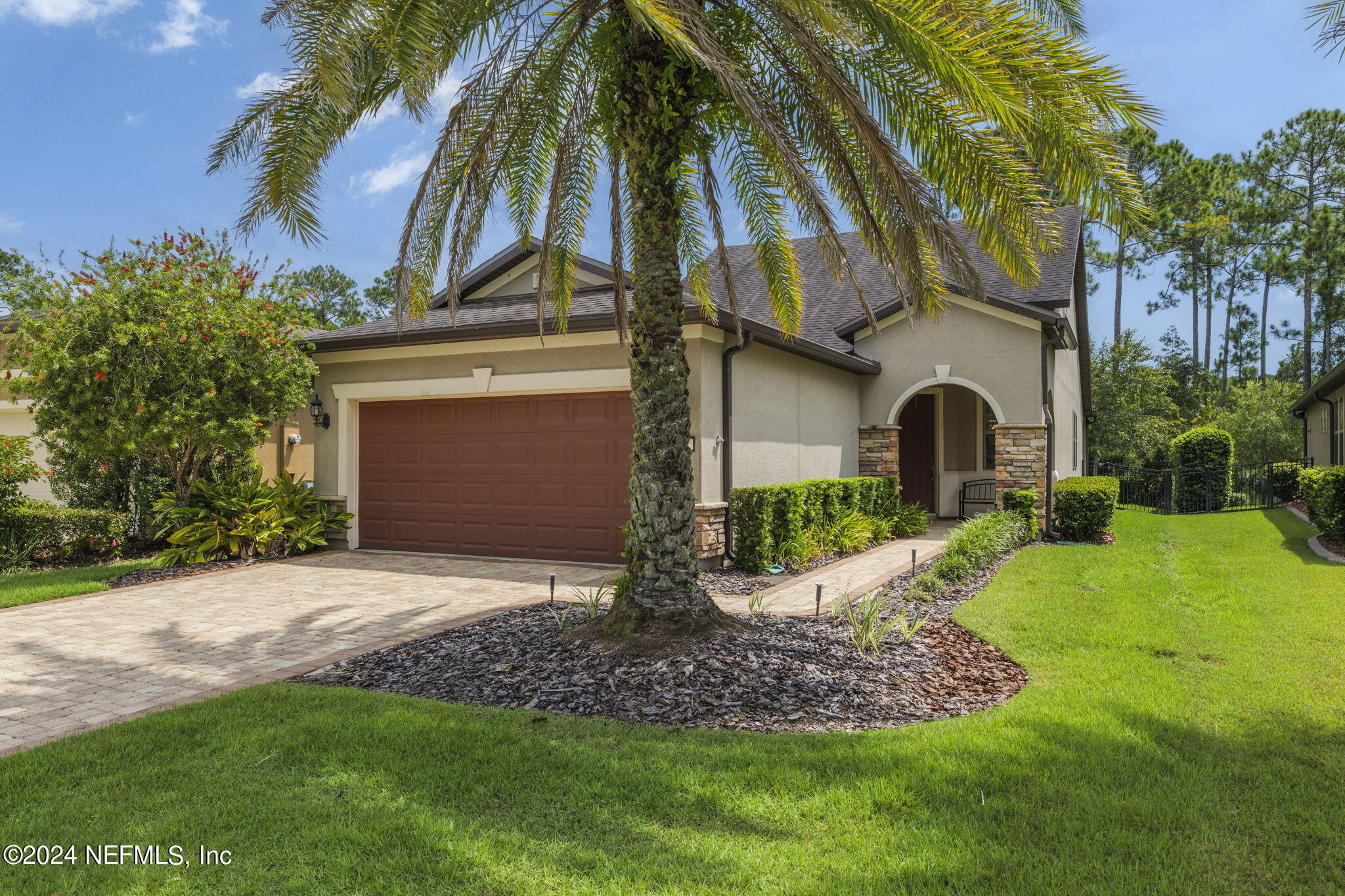 a front view of a house with garden