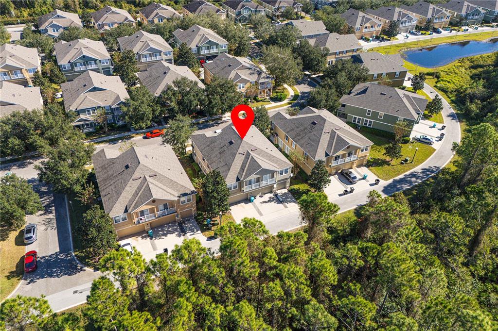 an aerial view of residential houses with outdoor space