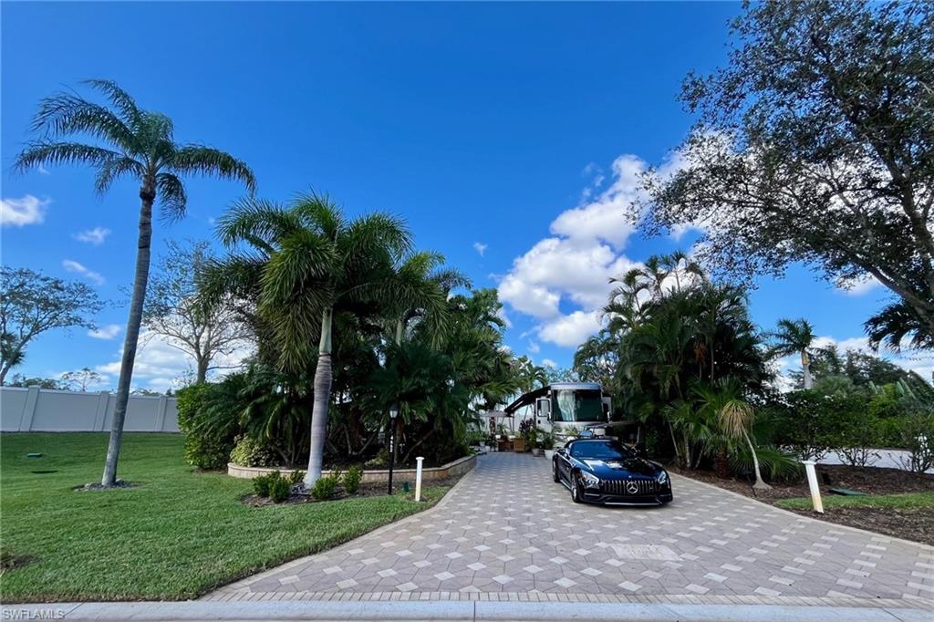 a view of a backyard with a parked car