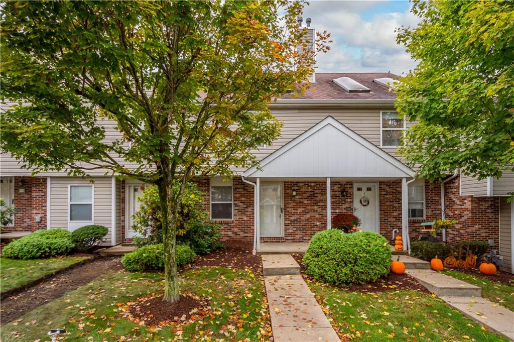 front view of a house with a small yard