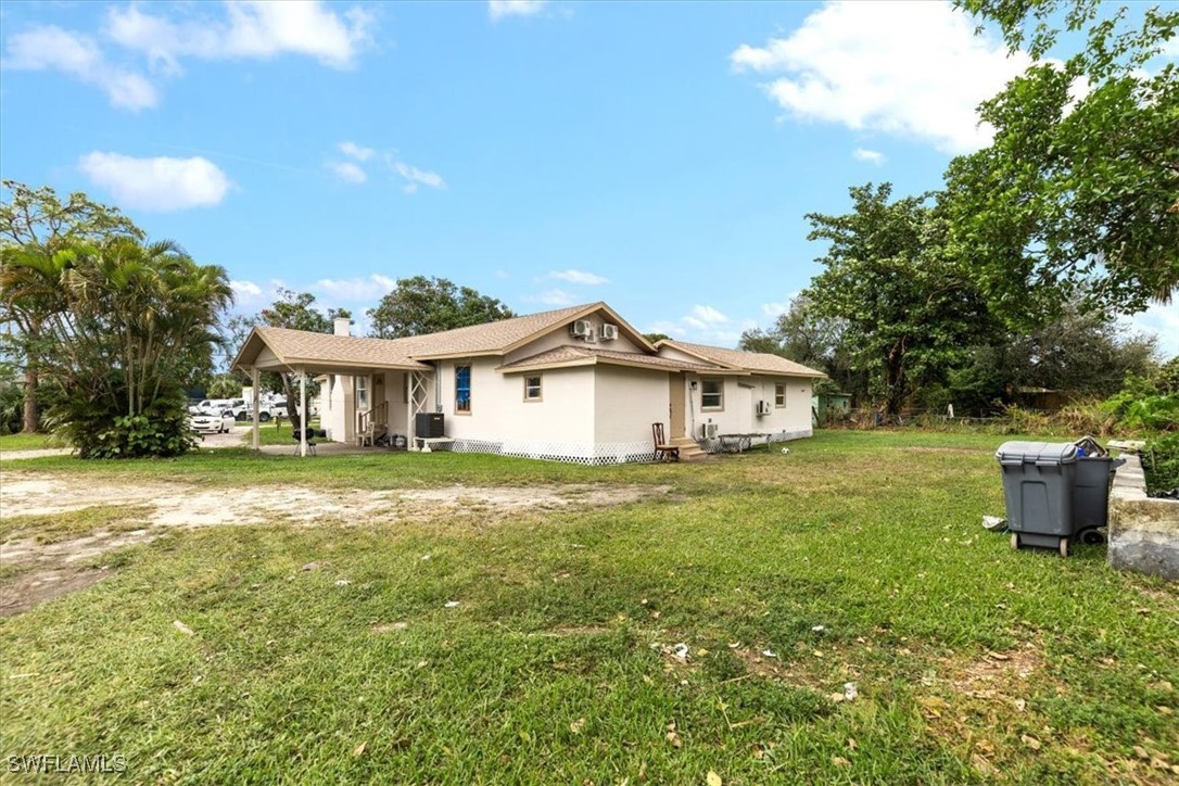 a view of a house with a yard