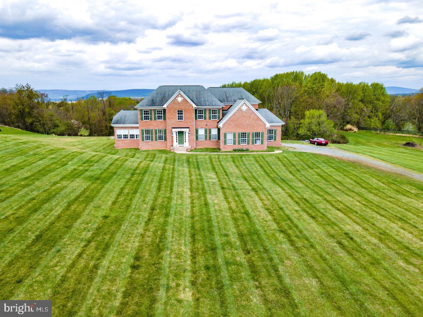 a view of a house with a big yard