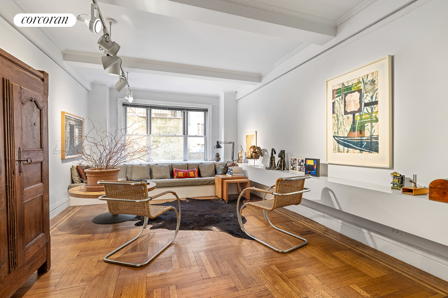 a living room with furniture windows and a chandelier