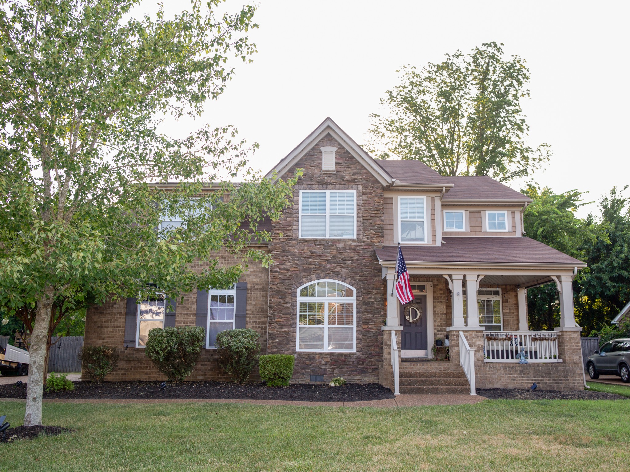 a front view of a house with garden