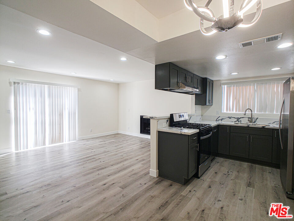 a kitchen with a stove and a microwave