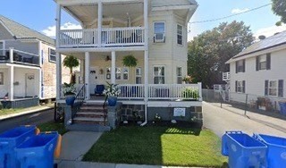 a view of a house with a chairs in patio