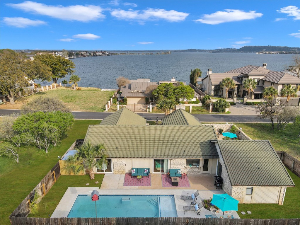 a view of a swimming pool with an ocean view