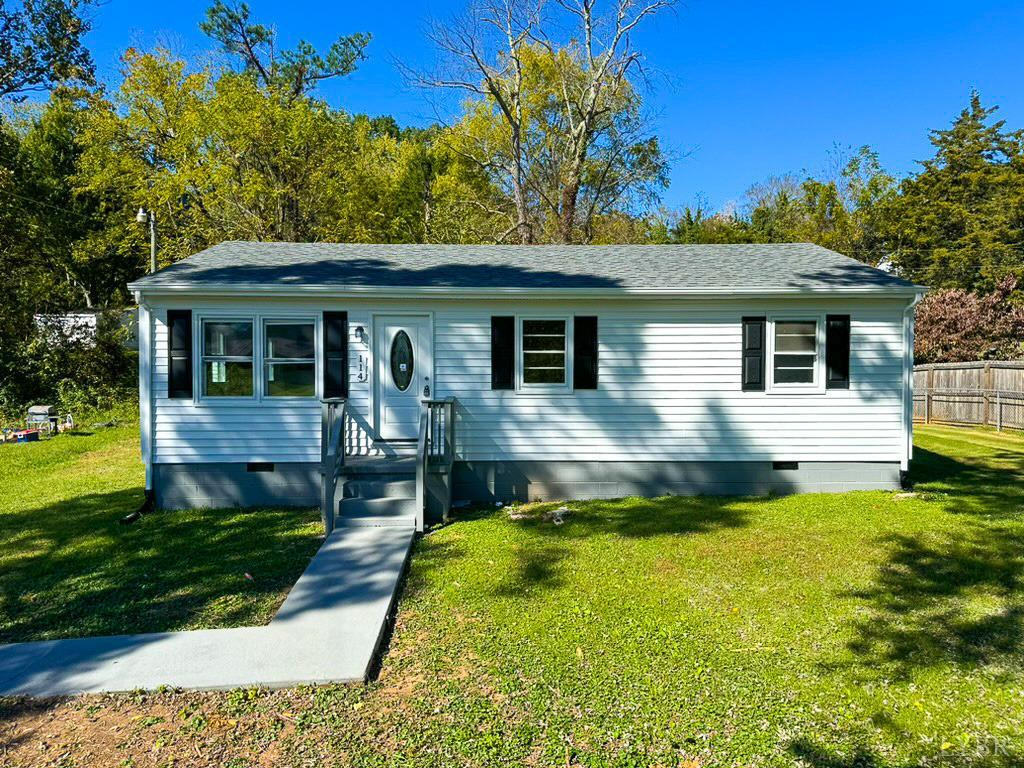 a view of a house with a yard patio and a patio