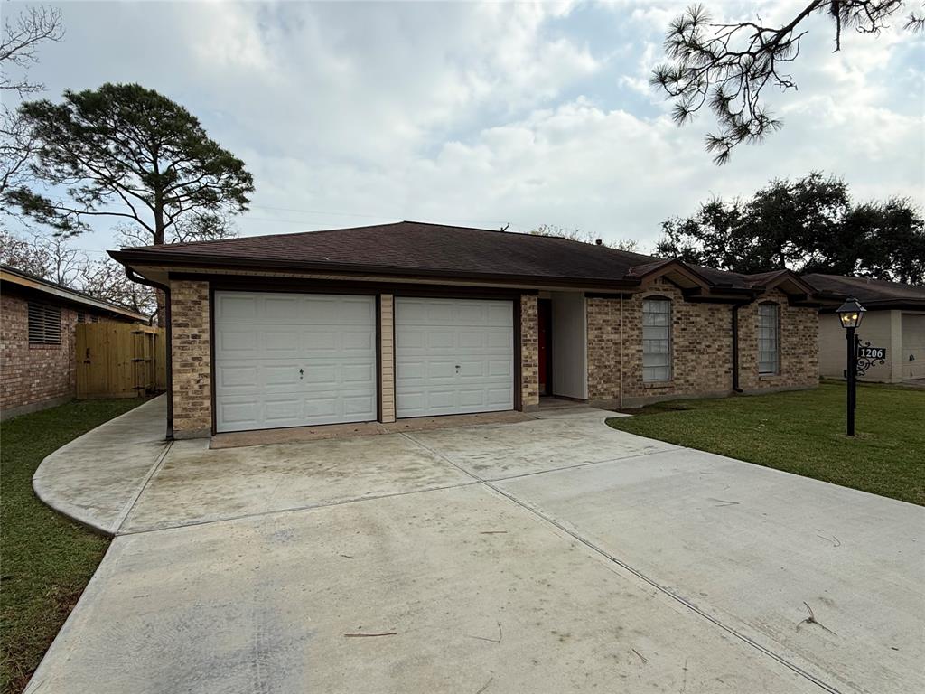 a front view of a house with a garage