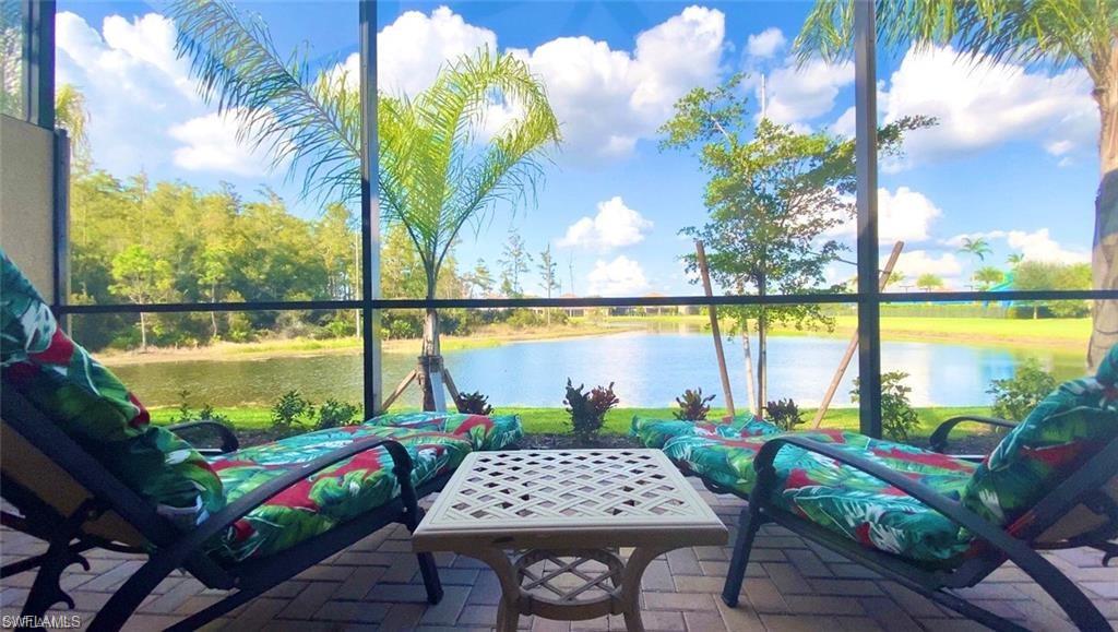 a view of swimming pool with outdoor seating