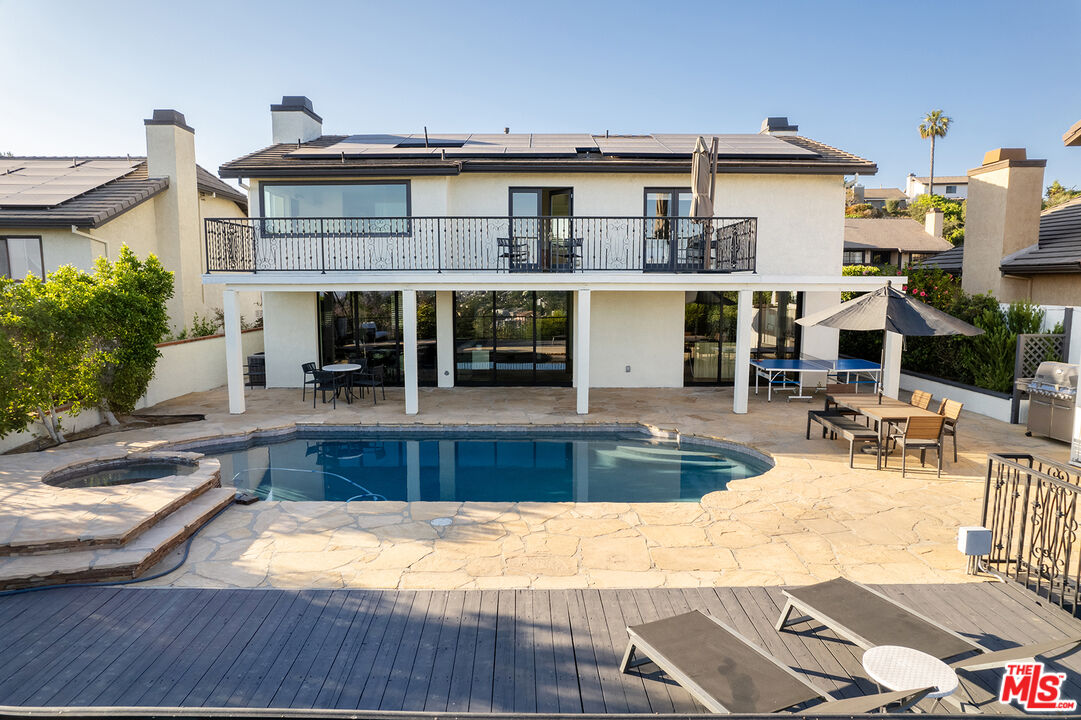 a view of a house with swimming pool