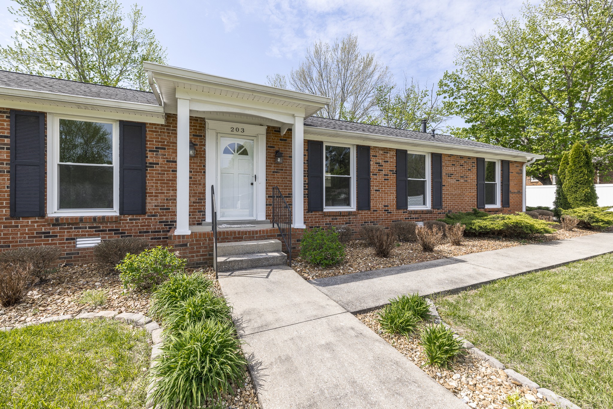 front view of a house with a yard