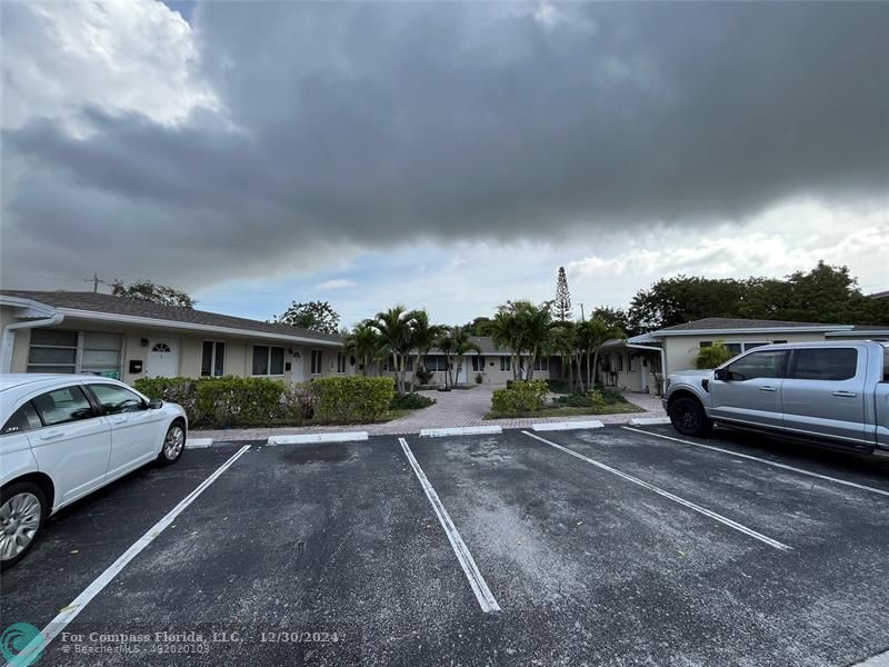 a view of a car parked in front of a house