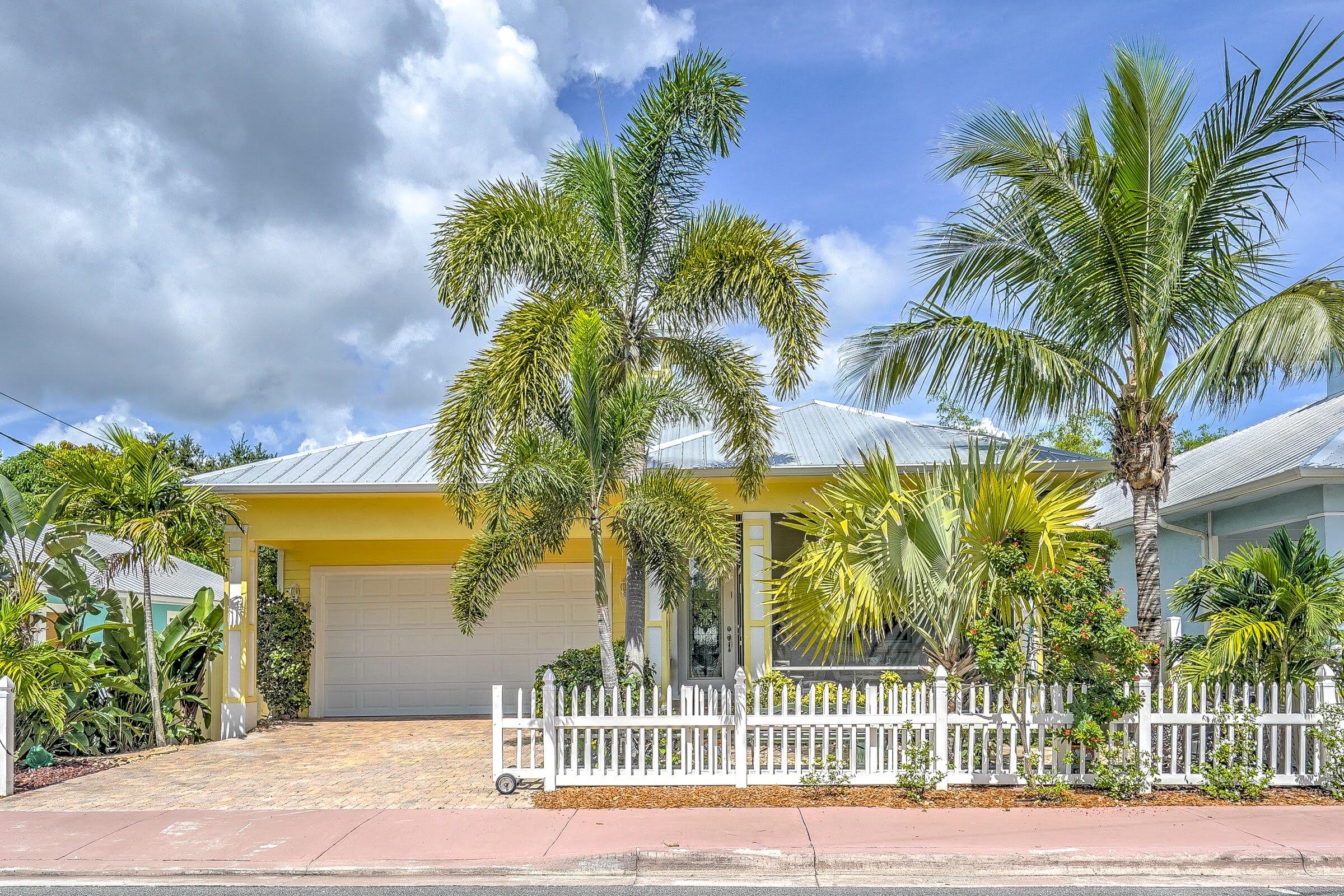 a view of a palm trees in front of a house