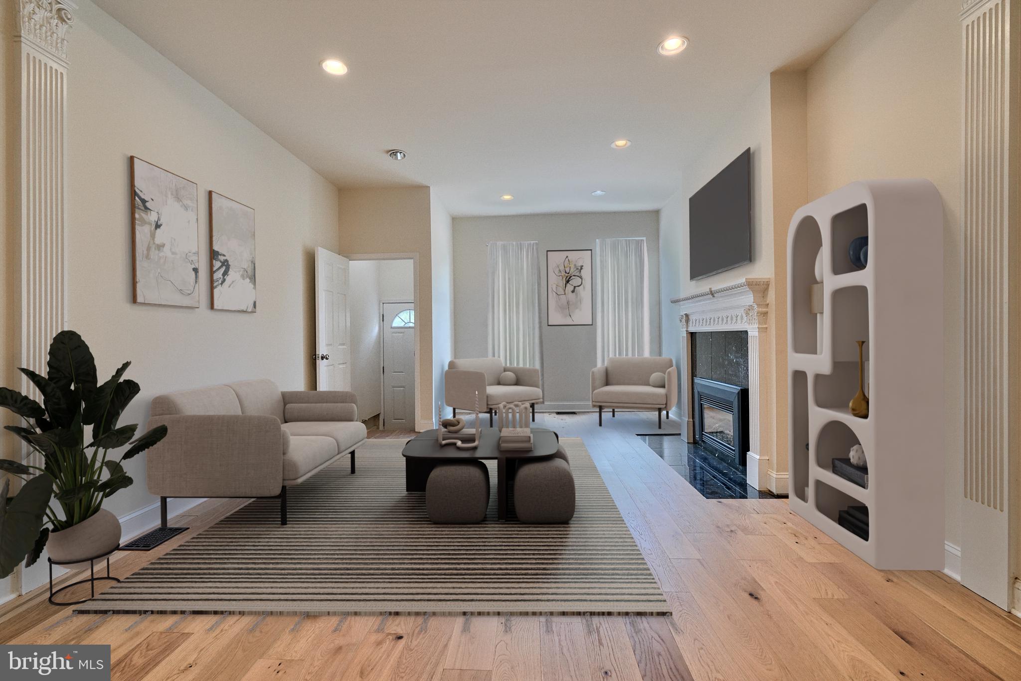 a living room with furniture fireplace and potted plant