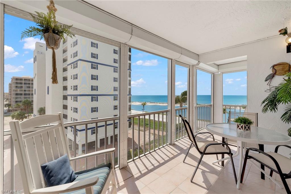 a view of a balcony with chairs