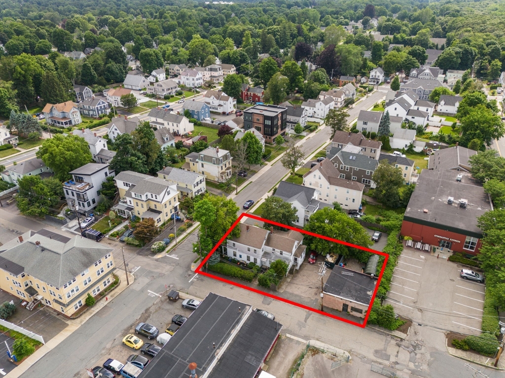 an aerial view of residential houses with outdoor space