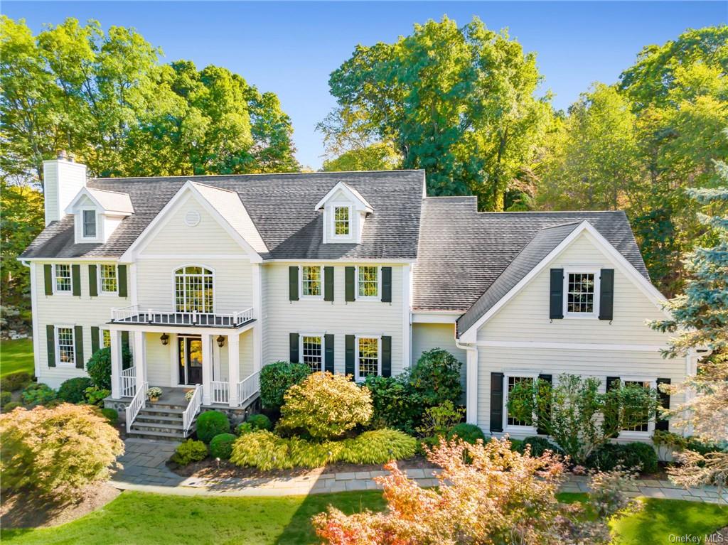 a aerial view of a house with a yard