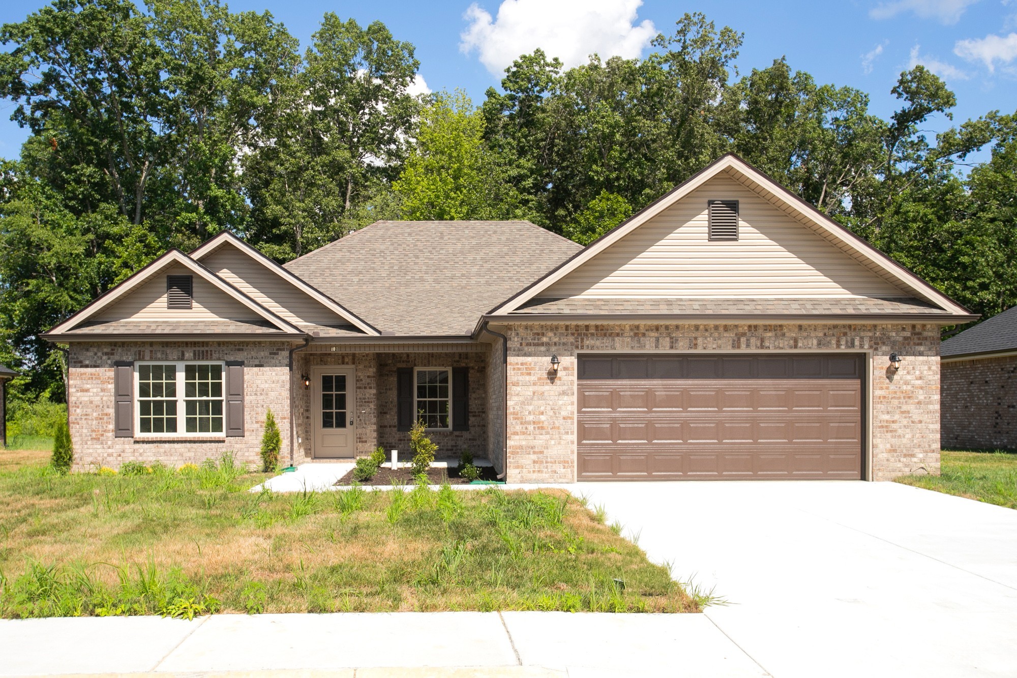 a front view of a house with garden