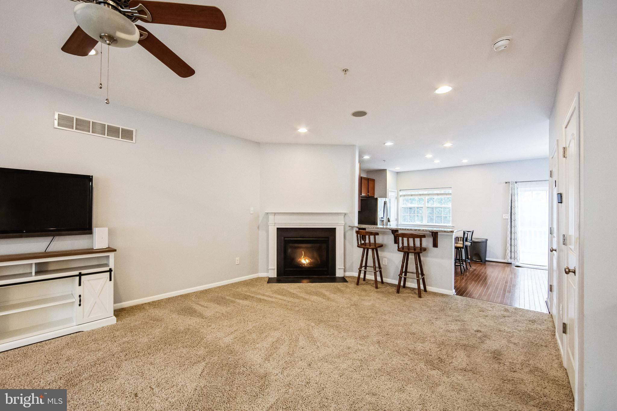 a view of a livingroom with furniture and a fireplace