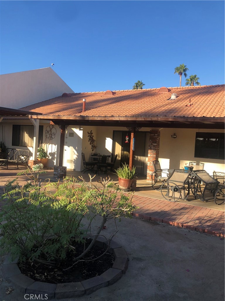 a view of a house with patio area