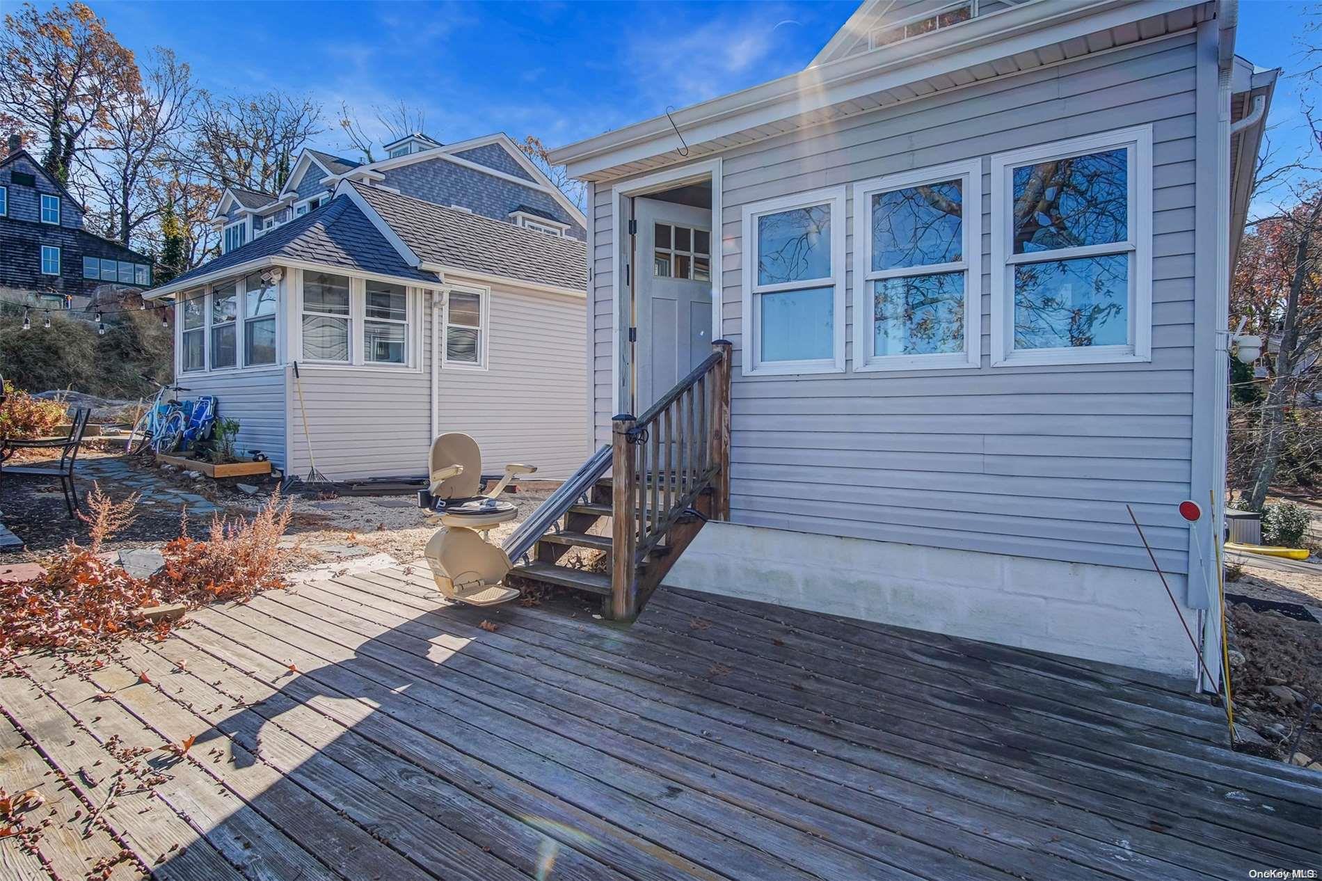 a view of a house with wooden deck