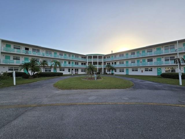 a view of building with yard