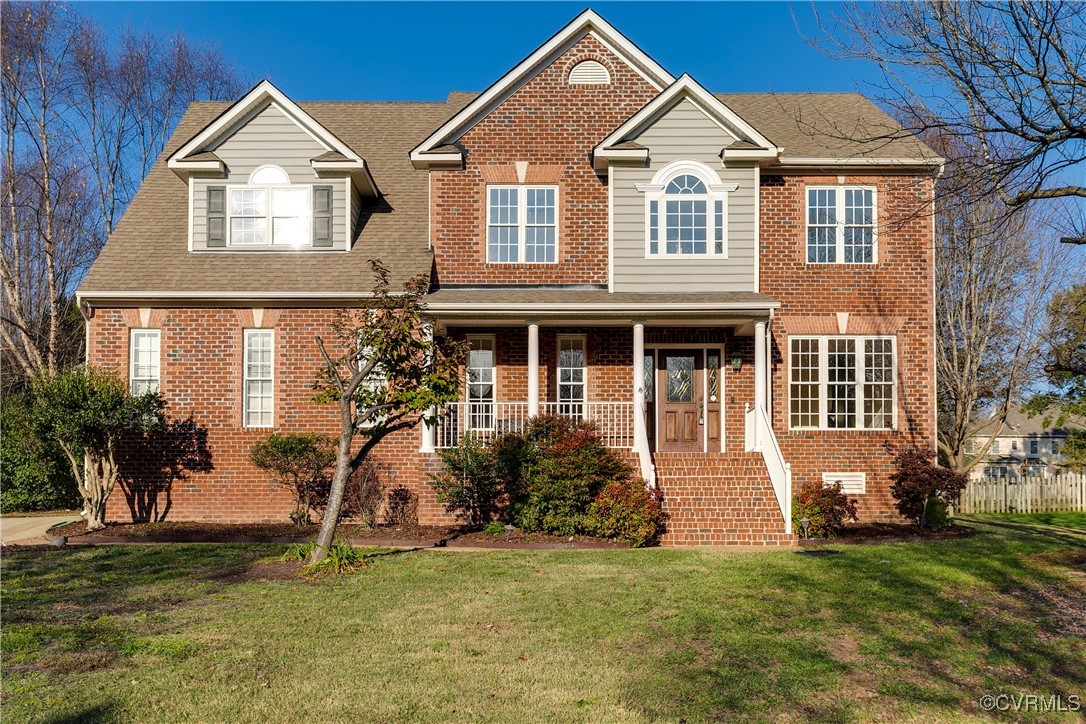 View of front of property featuring a porch and a