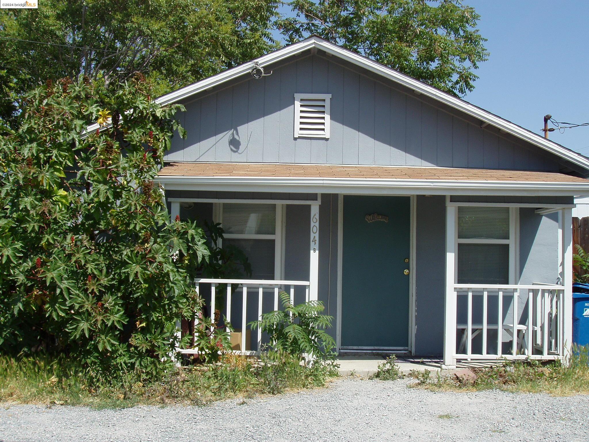 a house with a tree in the background