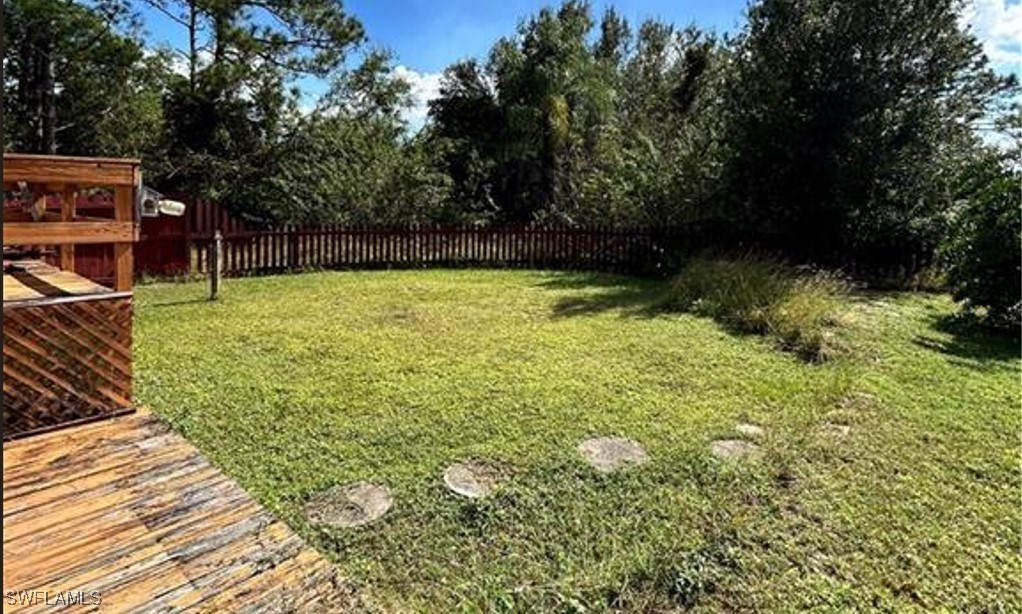 a view of backyard with green space