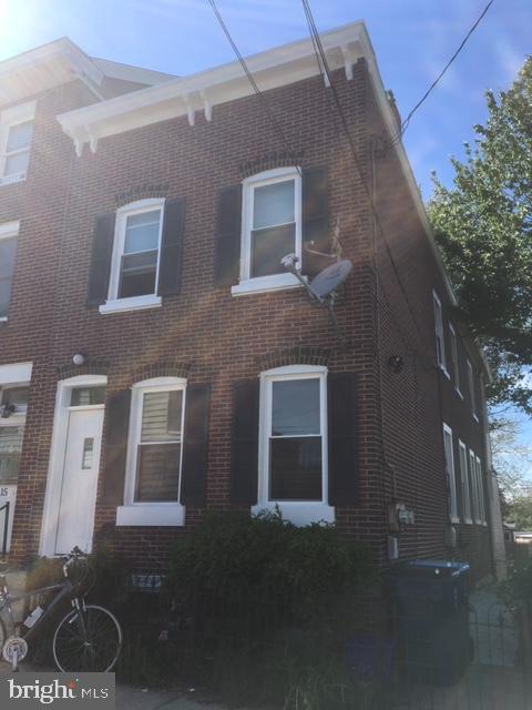 a brick building with a yard